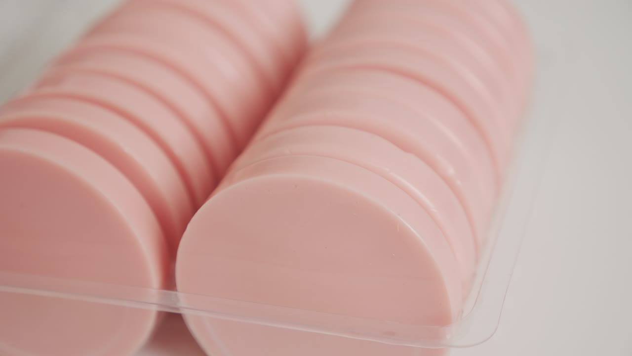 Round wax cake taking from the package 4K footage