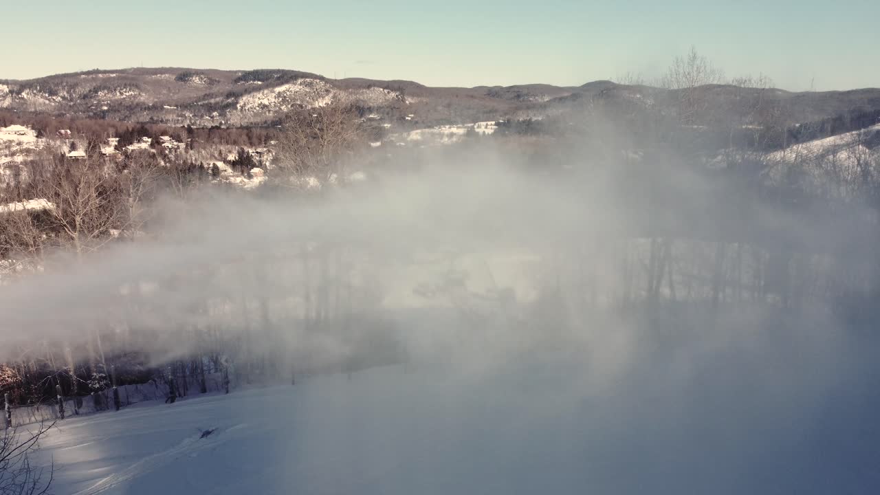 Snow Lance Making Snow At Ski Resort On Winter Day In Saint-Sauveur, Quebec, Canada. drone sideways