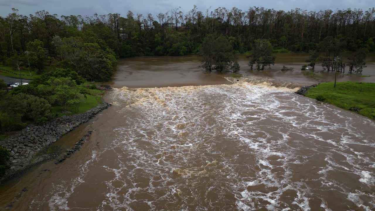 Coomera, Gold Coast, 2 January 2024 - Aerial view of Coomera River Causeway under flood waters from the 2024 Storms in January