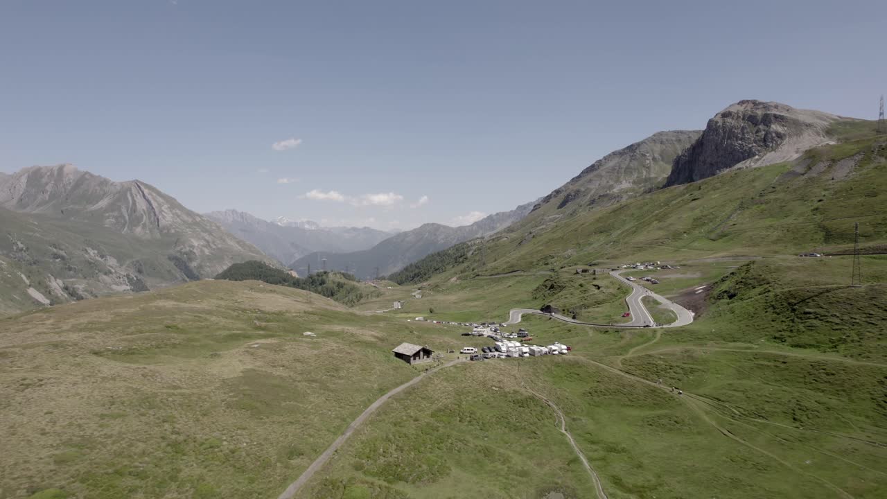 reverse and bird's eye view plane with drone video flying lake Verne and col du petit saint Bernard and valley Aosta