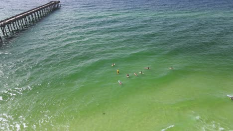 florida tourism - popular fun vacation spot in pensacola beach on gulf coast - aerial drone establishing view