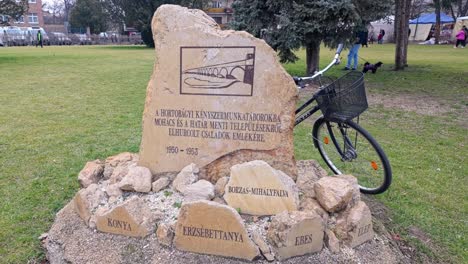 memorial stone in a park, commemorating the 1950-1953 deportations