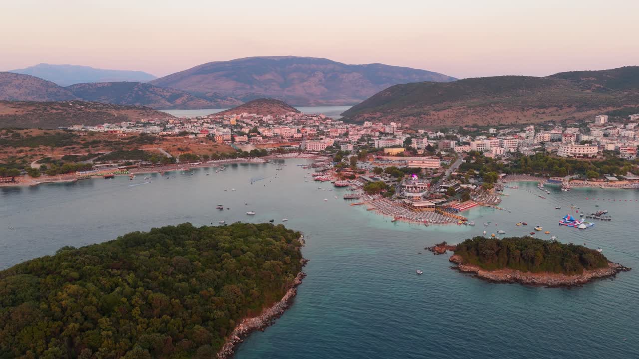 Ksamil Albania at sunset with islands, blue water, and a coastal town view