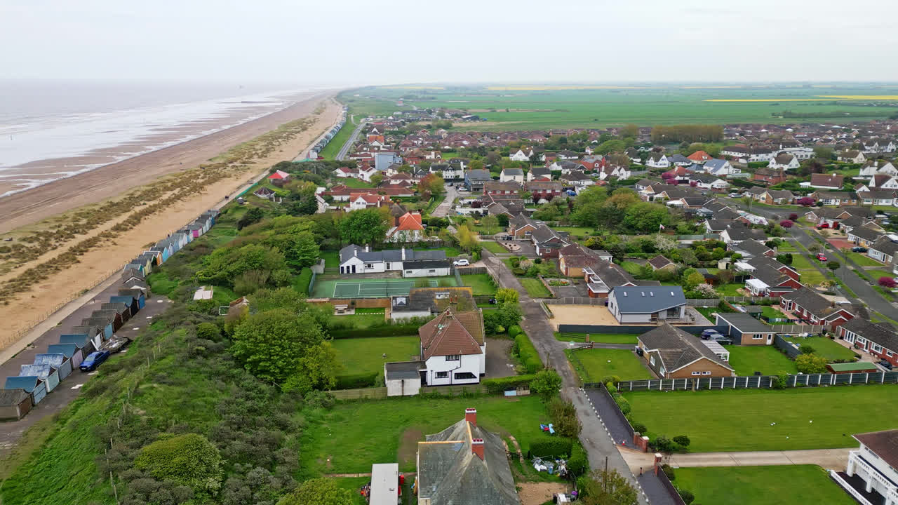 Discover the coastal haven of Mablethorpe through aerial views, spotlighting beach huts, sandy beaches, amusement parks, rides, and the tourist&rsquo;s delight