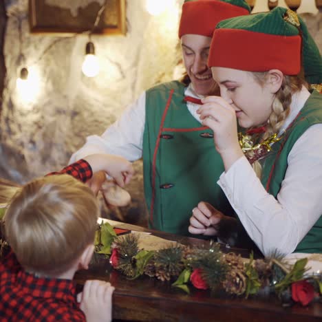 happy elves preparing letters with children