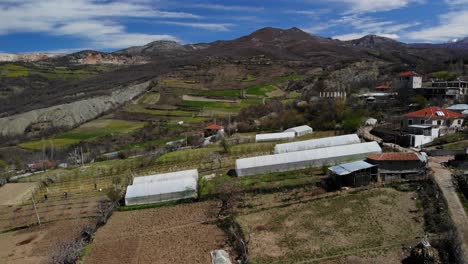 countryside with village and agricultural land on beautiful hills in albania