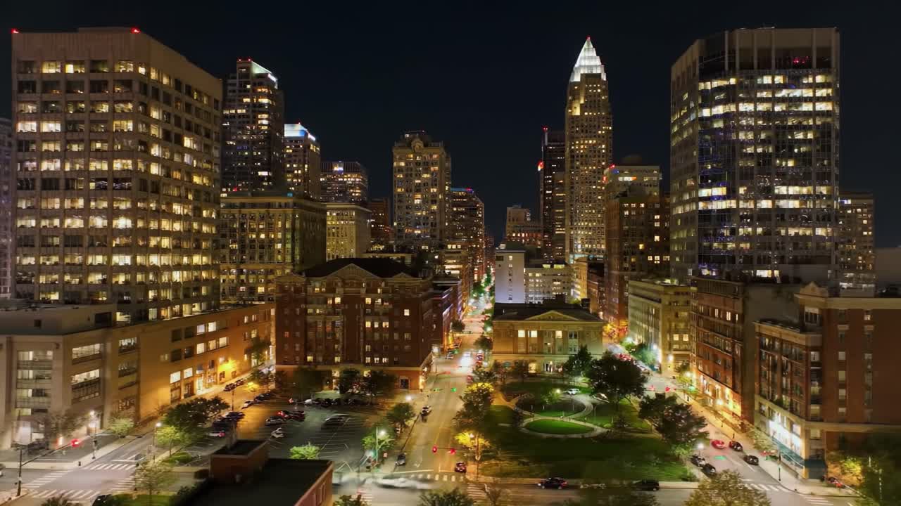 Stunning Night View of a Vibrant Urban Skyline Illuminated by City Lights, Showcasing Skyscrapers and Streets Filled with Life and Activity in a Bustling Metropolis