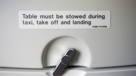 airplane table stowing instructions