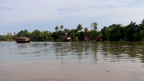 traditional houseboats running in sea backwater with amazing sky at morning video taken at alappuzha or alleppey backwater kerala india.