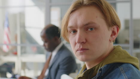 portrait of young caucasian man before visa interview