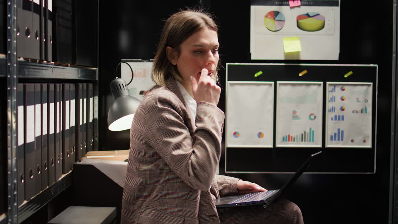 Business meeting in a small office filled with file cabinets