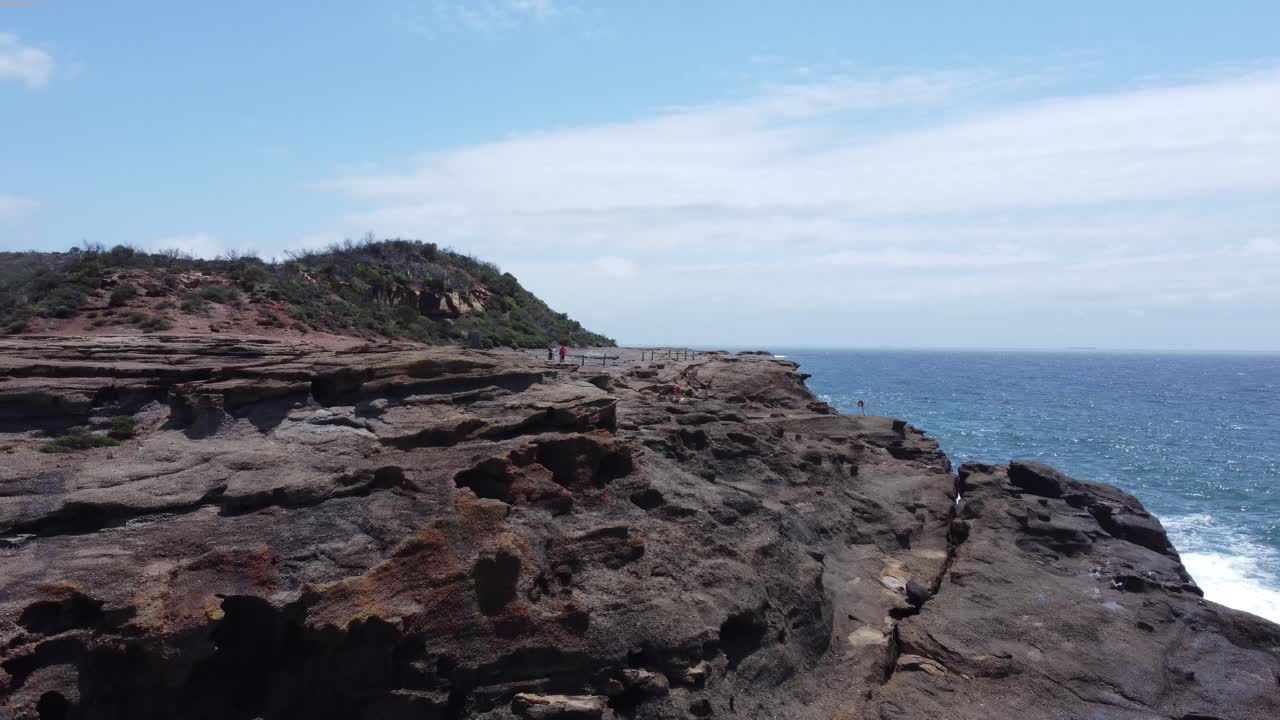 Aerial View of Stunning Coastal Cliffs and Ocean Waves