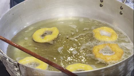 frying picarones a typical traditional dessert in peruvian food