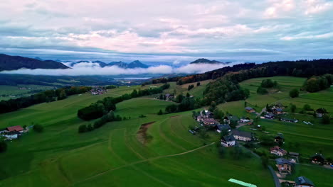 aerial drone dolly in shot of a small village in the mountains in austria