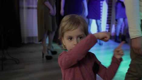 little child dance in the patry. feel happy, smiling. girl having fun on disco