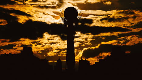 silhouette of city tower at sunrise/sunset