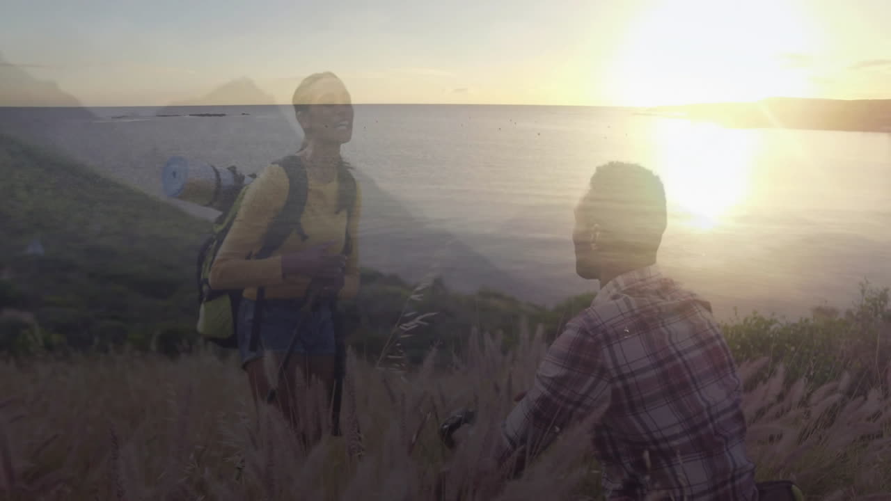 woman hiker laughing on coastal hillside at sunset, with animated backpack icon and route chart