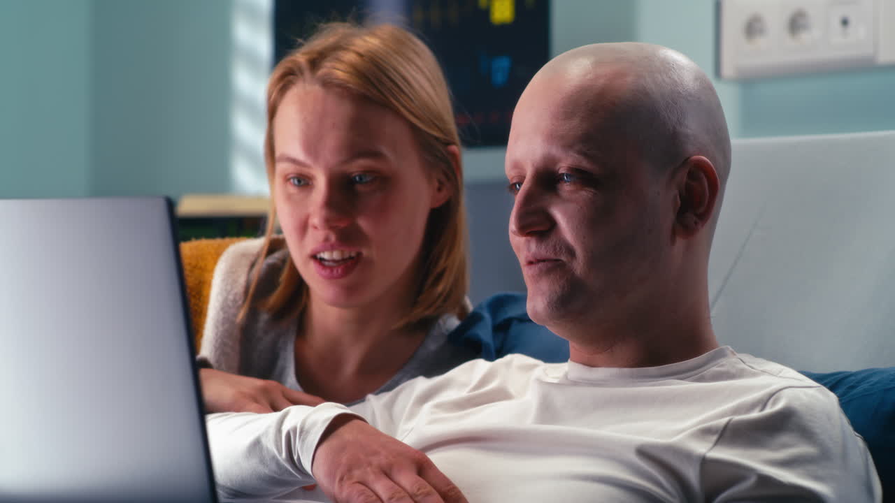 Couple supporting a patient in hospital