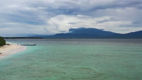 stormy cloudy day around tropical waters of gili trawangan in indonesia, aerial