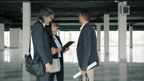 business meeting in empty commercial space