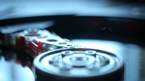 detailed close-up of a hard drive mechanism showing a read/write head and magnetic disks in motion, capturing the intricate technology behind data storage and retrieval