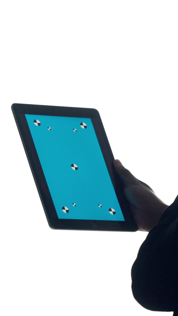 Hand Holding Tablet with Blue Screen and Tracking Markers