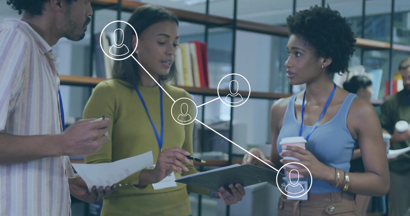 Business meeting sparking coworkers examining docs while animated network overlay connecting roles