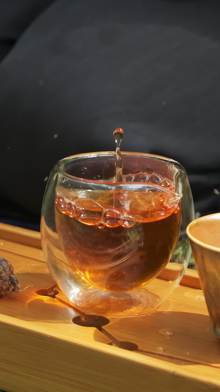 Pouring Tea into Double Walled Glass Cup