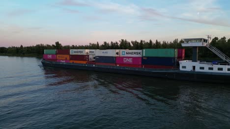 Cinematic-aerial-shot-of-container-ship-Casablanca-sailing-through-Zwijndrecht-in-the-western-Netherlands