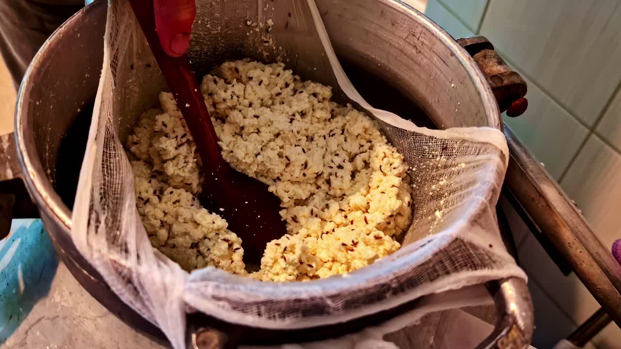 Cooking homemade cheese in a cozy kitchen in Cesis, Latvia