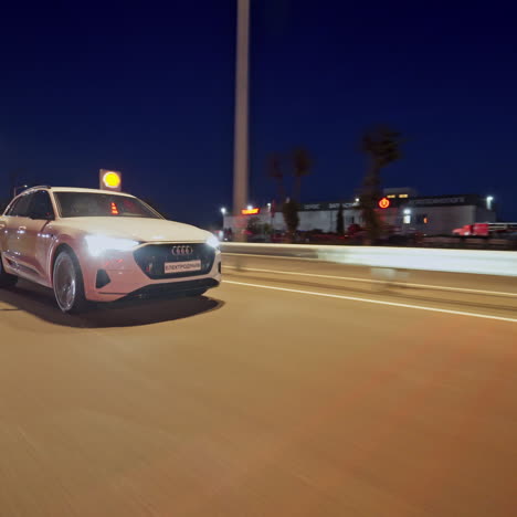 presentation of a white audi e-tron, compact luxury crossover suv. modern new cars for sale