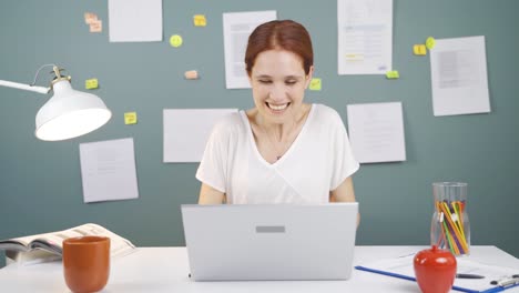 Woman-joyfully-embracing-laptop.