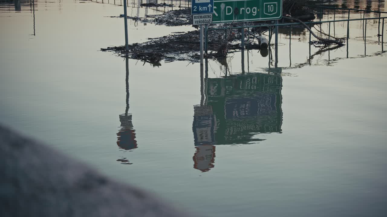 Flooded Road and Submerged Signs