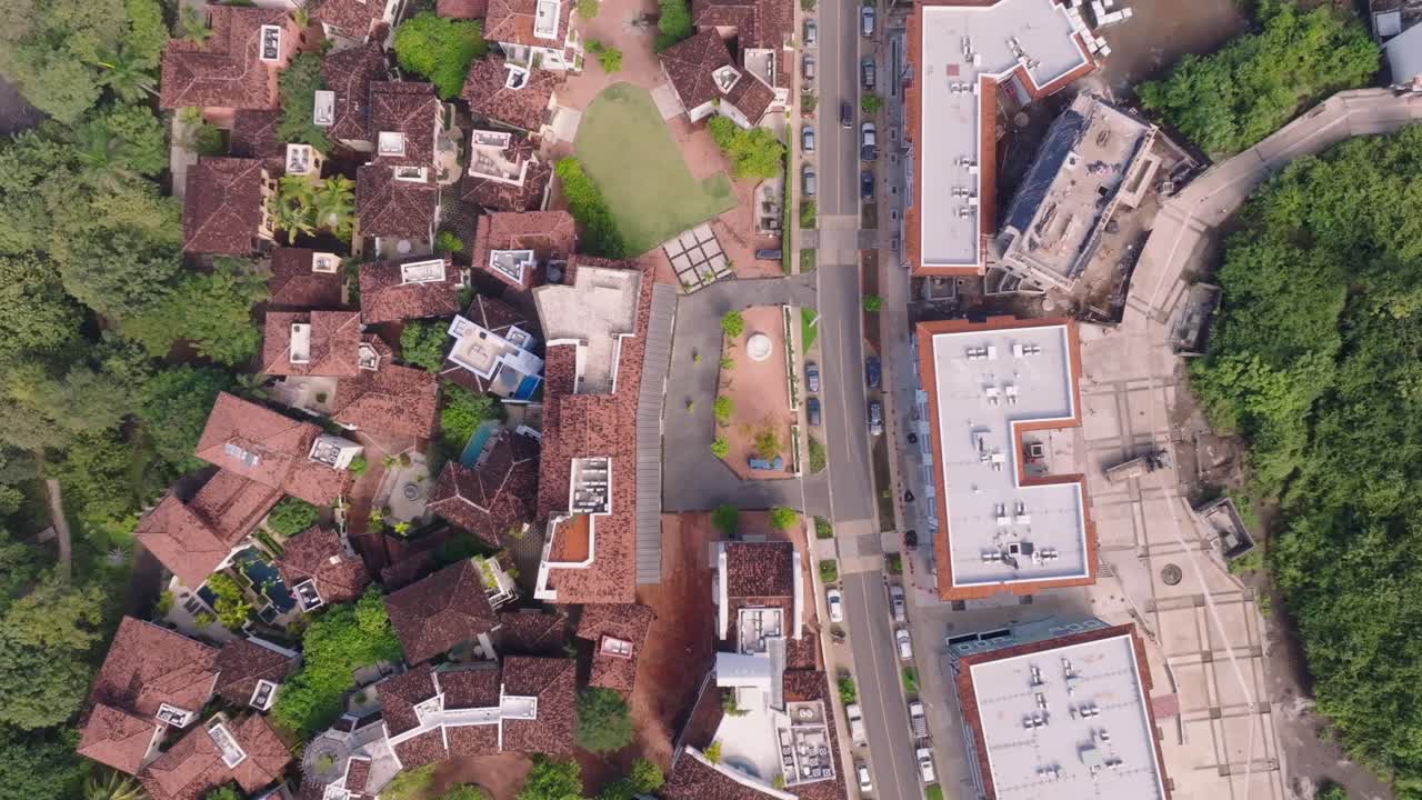 Las Catalinas, Guanacaste Province in Costa Rica showing homes, mountains and ocean with drone video overhead