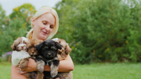 Happy-Woman-Holding-Cute-Puppies
