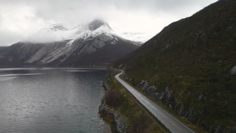 Narrow-Road-By-The-Mountain-And-Scenic-View-of-The-Stetind-In-Norway---aerial-shot