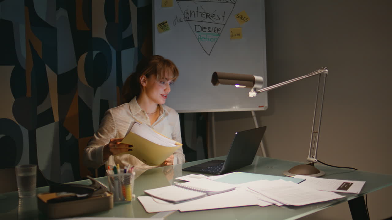 Evening employee video calling laptop having conference sitting office closeup
