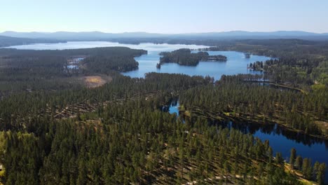 aerial view of lake busjon in dalarna, sweden at daytime - drone shot
