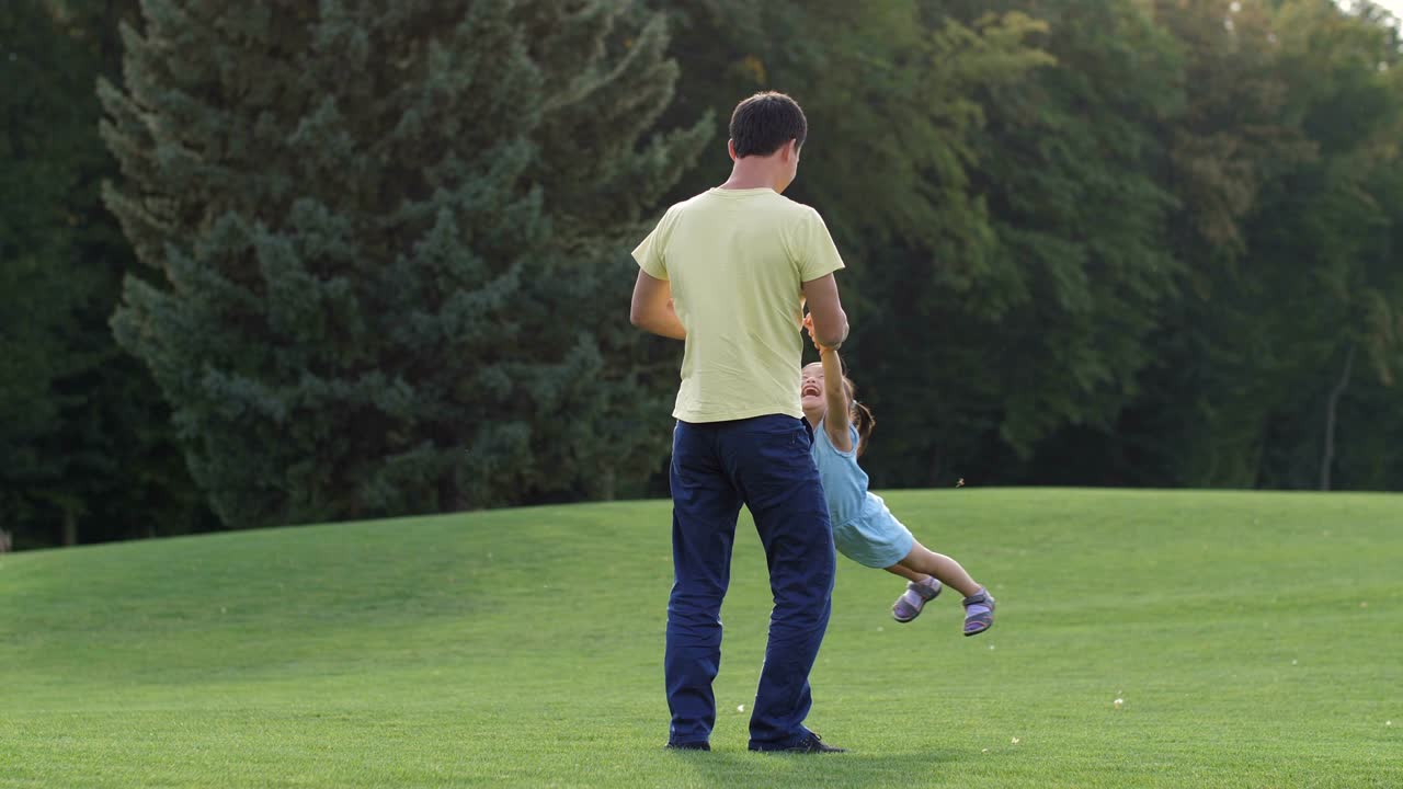 Loving asian dad playing with his lovely daughter