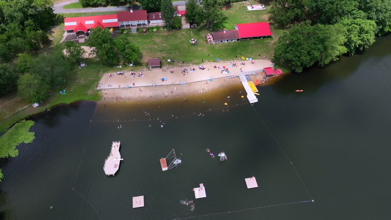 Mt. Gretna Lake and Beach at Lake Conewago. Popular summer swimming spot in Pennsylvania. Families with kids having fun in water park. top down shot.