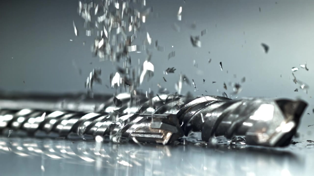 Slow Motion of Metal Shavings Falling on a Drill Bit