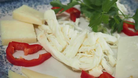 plate of string cheese and other cheeses