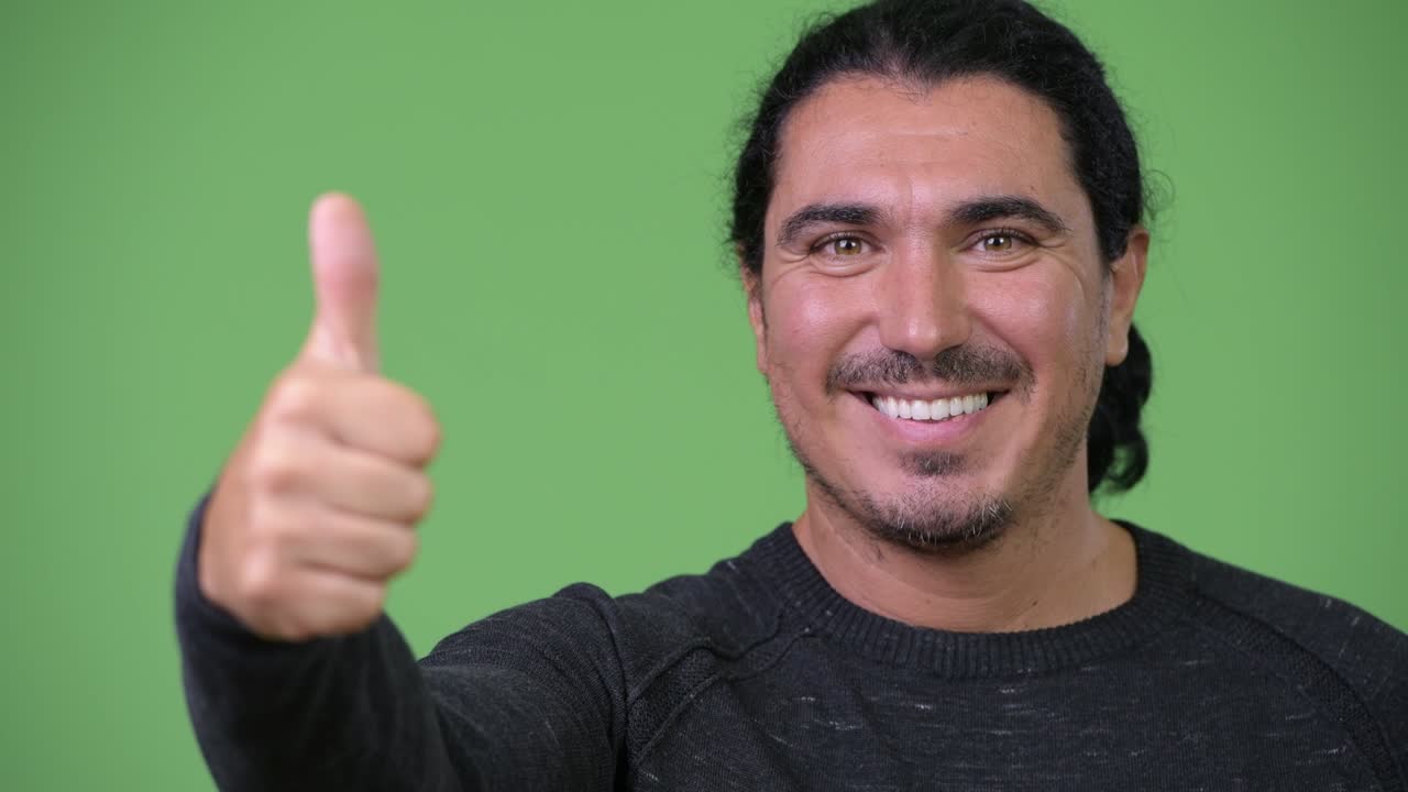 Handsome man giving thumbs up