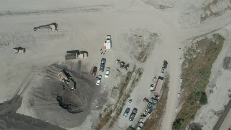 Top-down-aerial-view-flying-over-an-aggregate-pit-mine