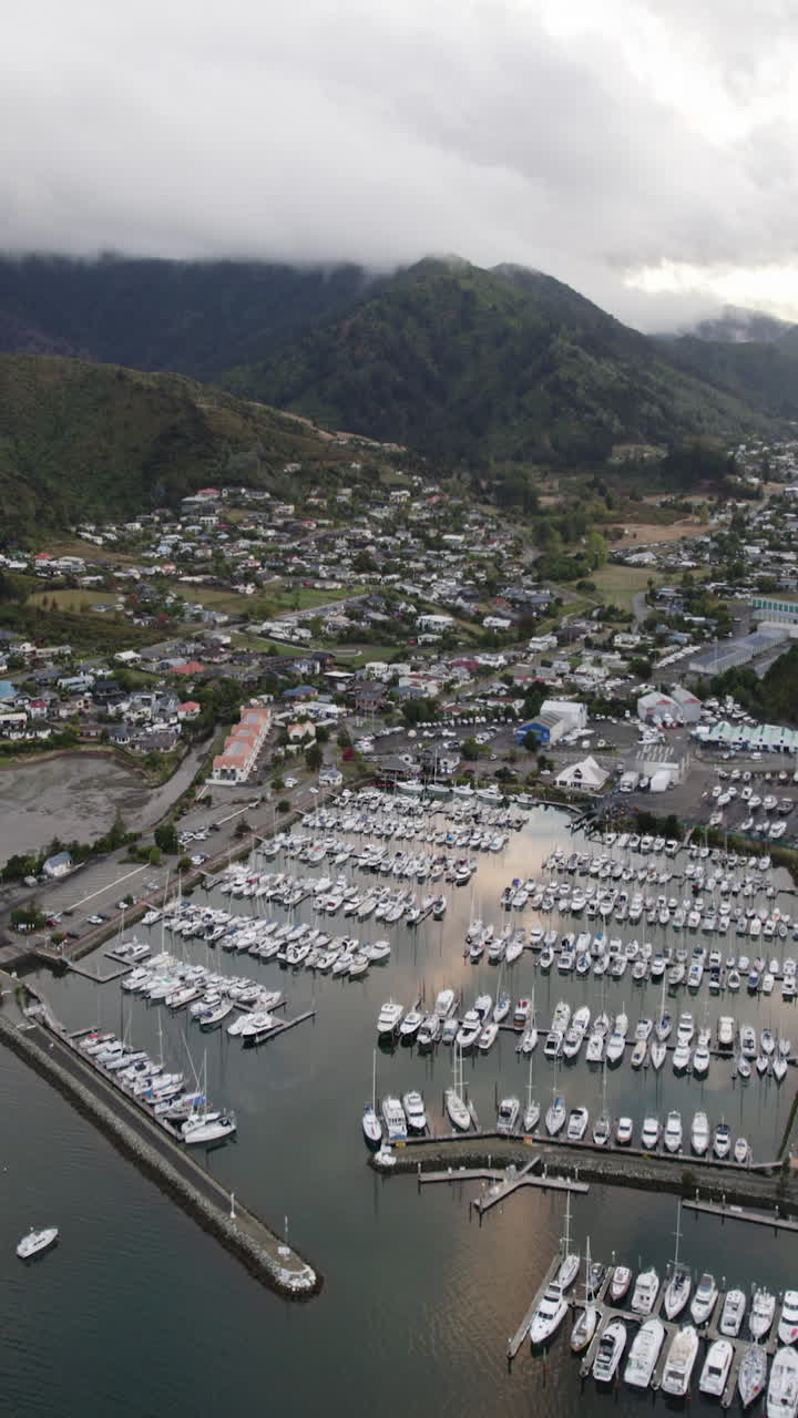 Vertical drone shot overlooking the Waikawa marina and town, in New Zealand