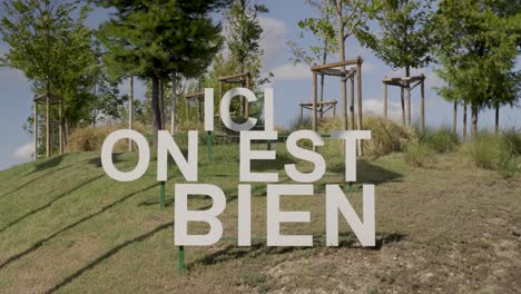 sculptural signage amidst serene parkland