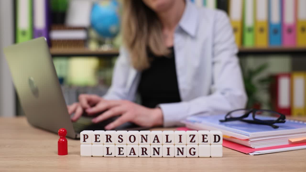 Personalized learning concept with a woman using a laptop in an office setting