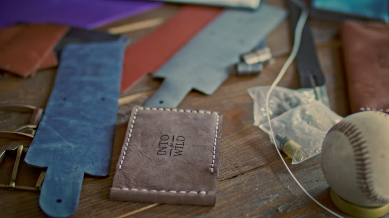 Leather maker drawing sketch in notebook. Product designer drawing new product