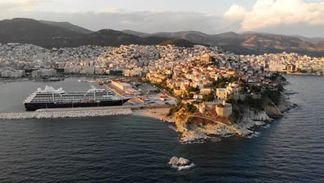 Aerial-Point-of-Interest-Shot-of-Kavala-Old-Town-Fortress-and-Port-with-Cruise-Ships,-Cinematic-4K-Footage