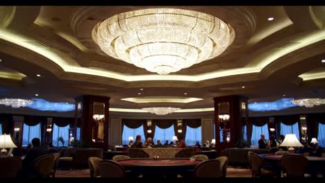 elegant grand hall with stunning chandeliers and sophisticated ambiance, showcasing a luxurious meeting space for guests and relaxation.